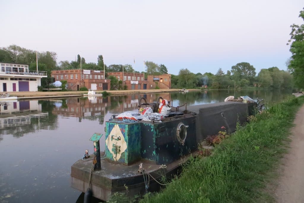 a view from the towpath towards rowing sheds