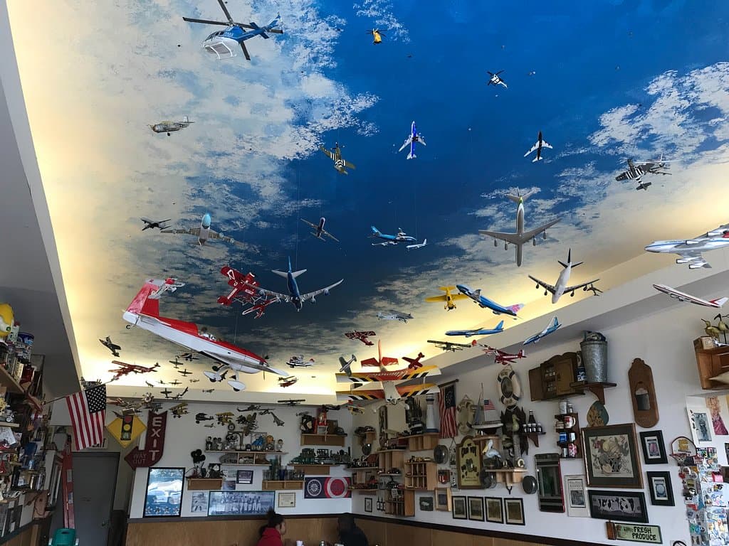 The ceiling displays many model airplanes