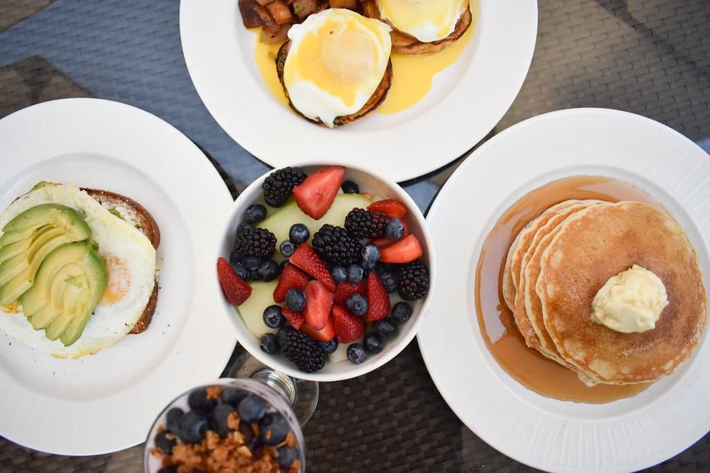 Avocado Toast, Eggs Benny, Fruit bowl, Parfait, and Pancakes