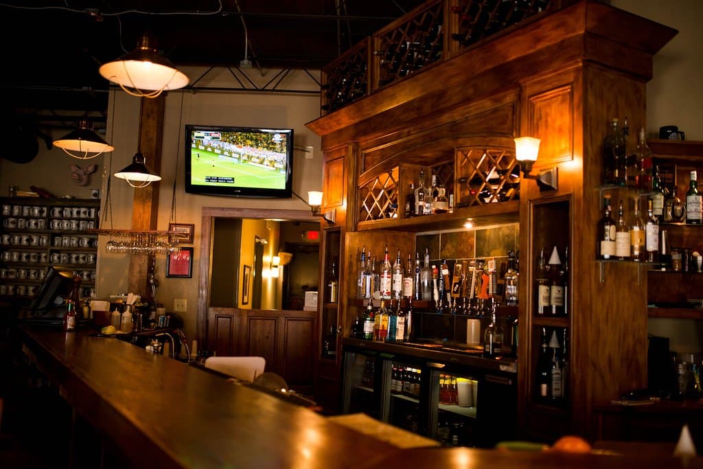 Polished wood bar with full selection of local beers, craft cocktails and fine wine 