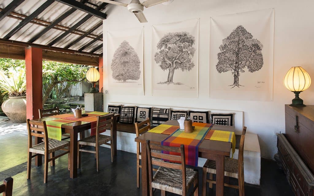 The veranda tables next to the Barefoot art gallery.