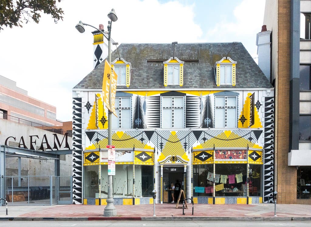 The facade of the Craft & Folk Art Museum was painted by Shrine, a Los Angeles-based artist who creates large-scale installations for art festivals around the world.