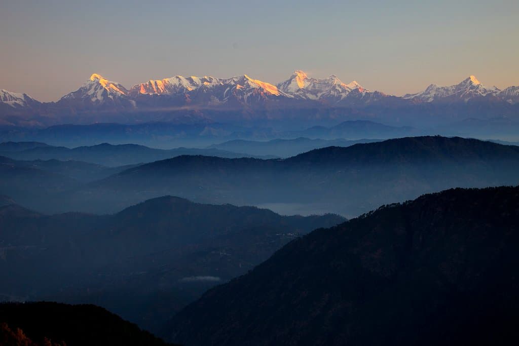 Snow clad Himalayas view while driving through Kilbury forest to reach Muskotia