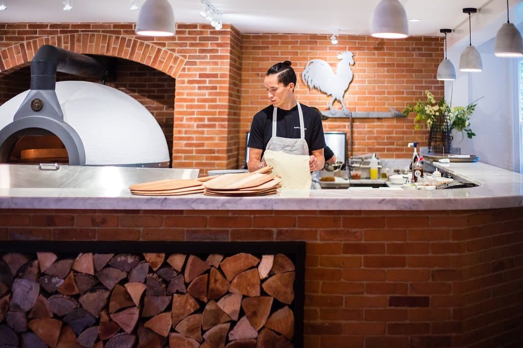 Our open kitchen allows guests to watch as our Chefs prepare each pizza by hand and load it into our one of a kind pizza oven