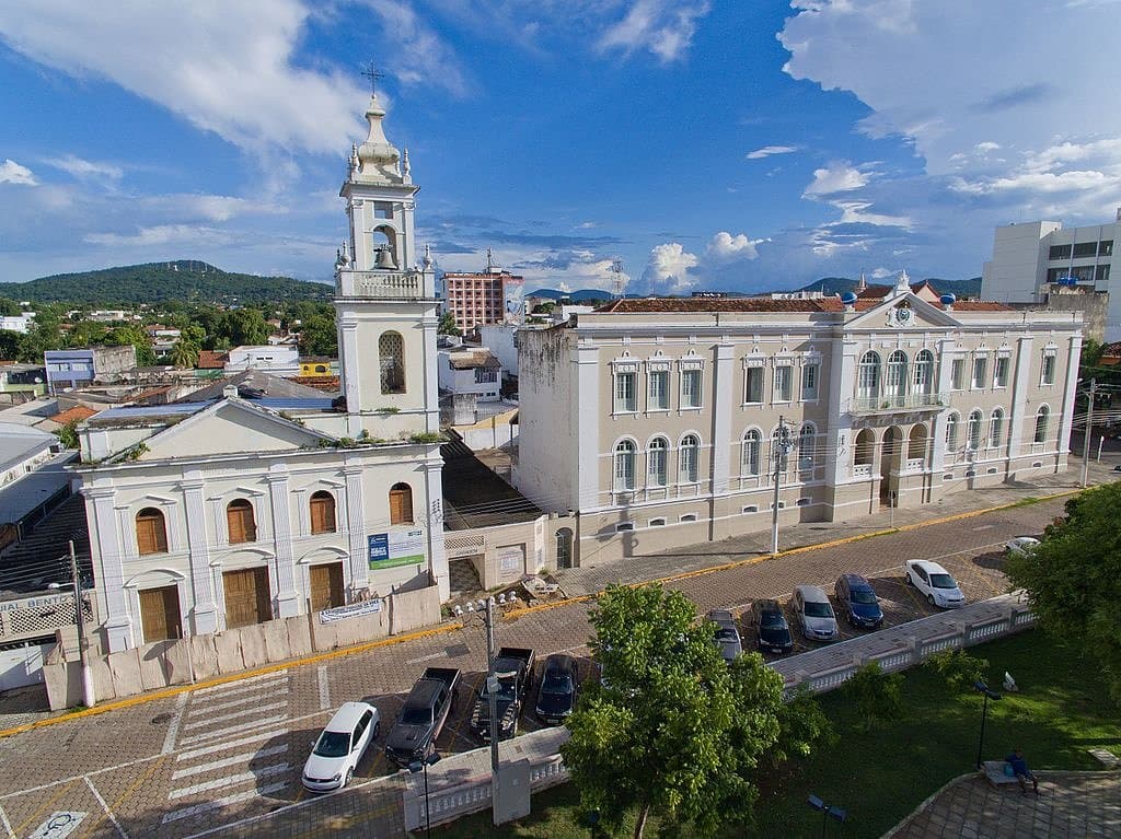 Aerial drone view of Corumbá, Mato Grosso do Sul, Brazil. View above the Praça da República showing Igreja de Nossa Senhora da Candelária and Luis de Albuquerque Institute building. This was taken in March 2017.  Note the wall around the church indicating it is closed. This was still closed (with no evidence of restoration work) in January 2019. Parts of the church are at risk of crumbling.