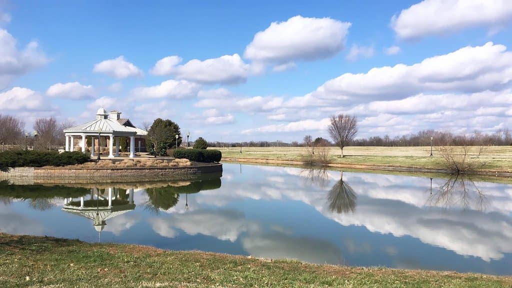 The pavilion on Gateway Island reflecting in the water.