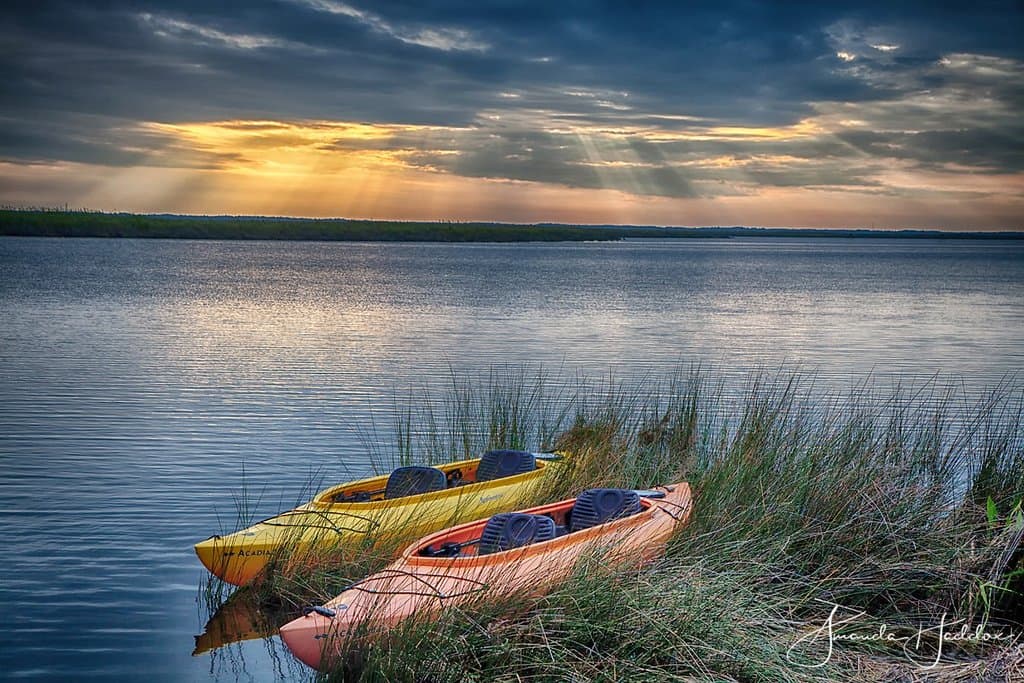 Kayaks in the bay at sunset