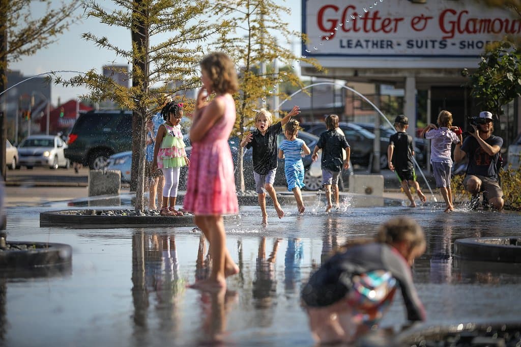 Children playing on the Plaza of Crosstown Concourse