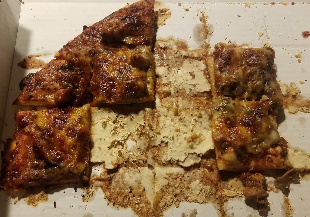Overcooked and stuck to cardboard.