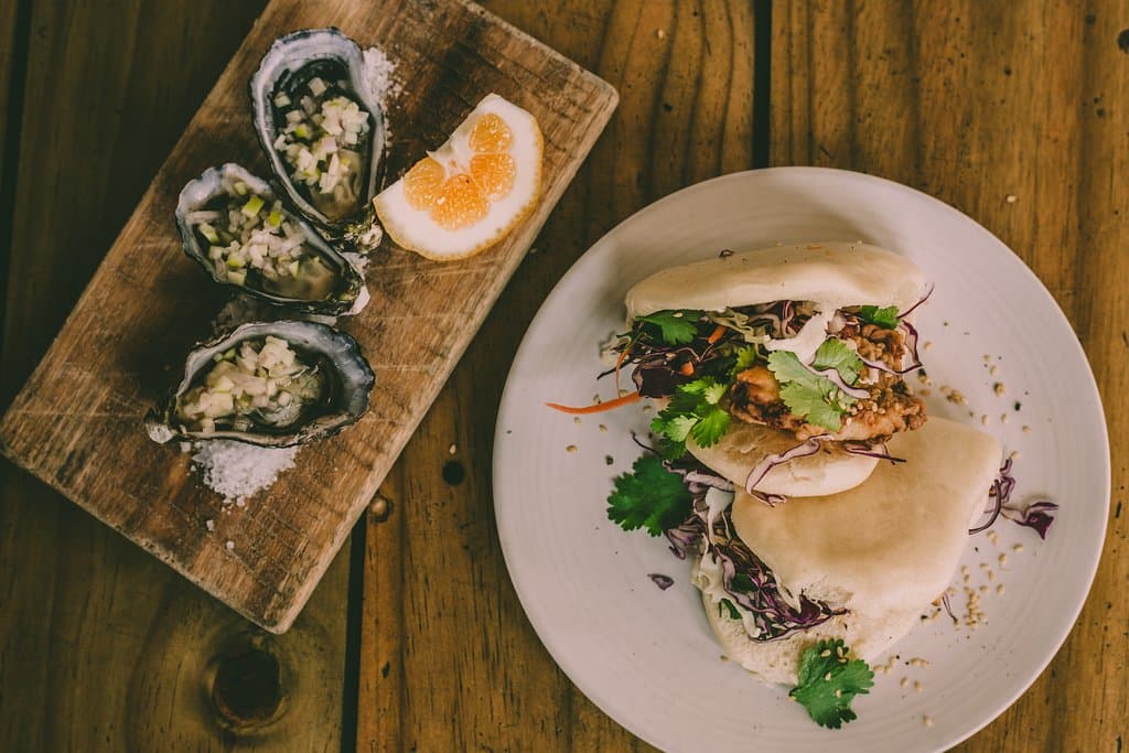 Freshly Shucked Te Kouma Bay Oysters w Southern Fried Snapper Bao Buns