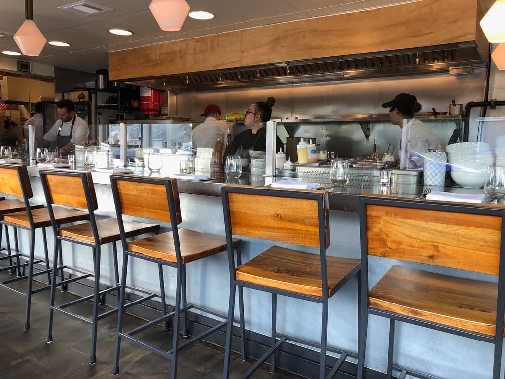Seating at the bar so you can watch your food being cooked was popular among regulars. 