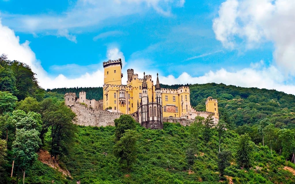 Resting high above the river Rhine, witness the medieval Stolzenfels Castle as we drift along the German shoreline.