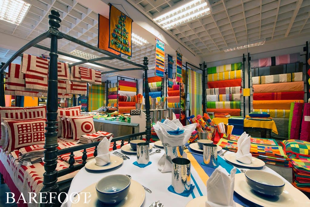 The fabric display & a collection of table and bed linen. Table cloths, cushion covers, fabric by the meter, napkins, and much much more.