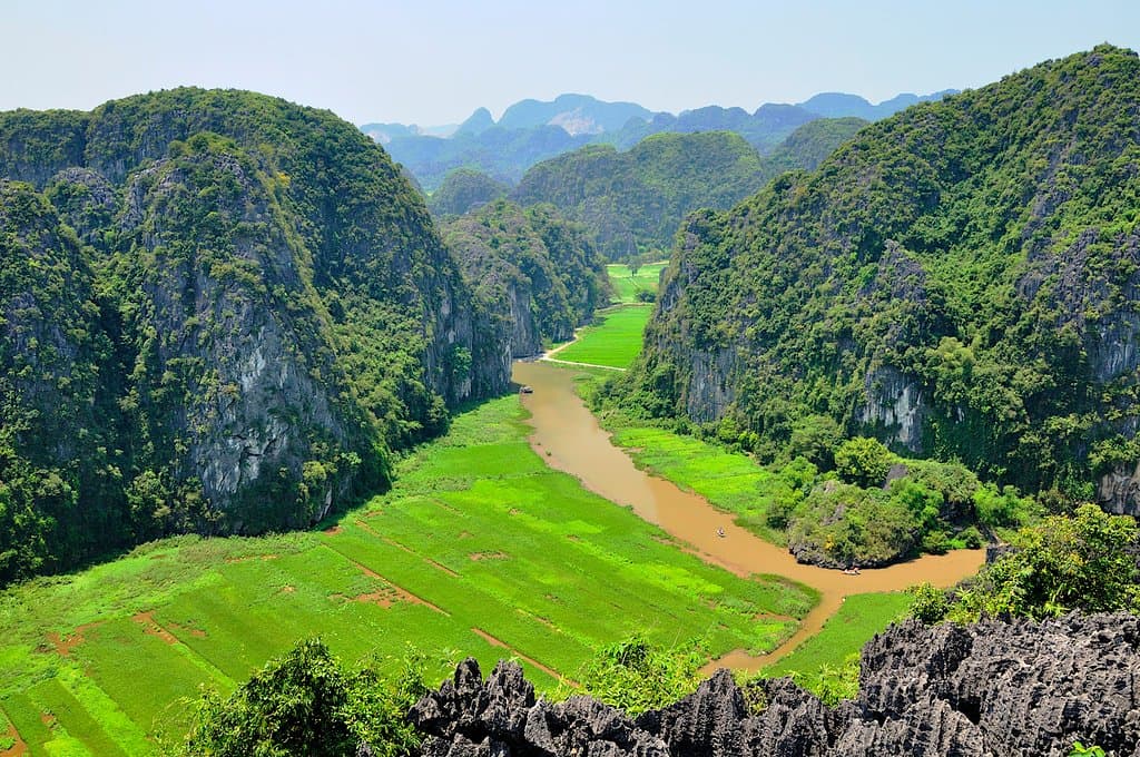 A landscape which blends man made padi field with karst landform in Tam Coc, as seen from Mua Hill, Ninh Binh Province, Vietnam.