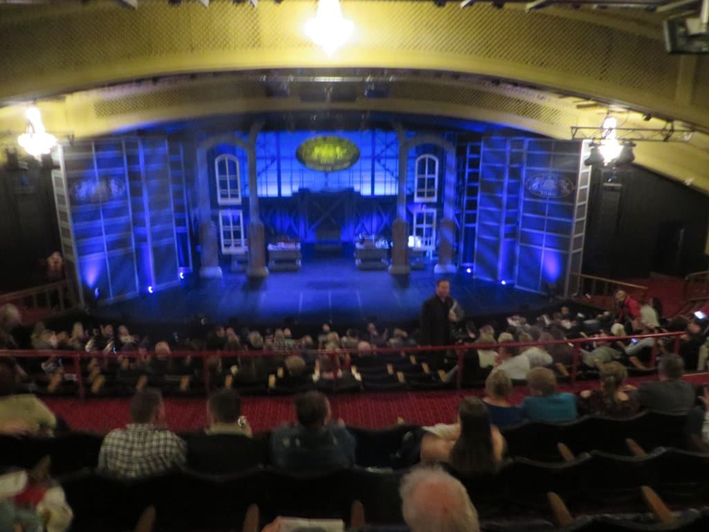 Stage set before the show began. Entertaining pre-show warning, request, threats to turn-off your cell phones, put away your cameras.