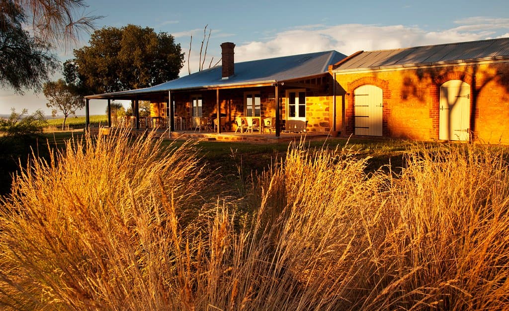 The stables and grain room at sunrise
