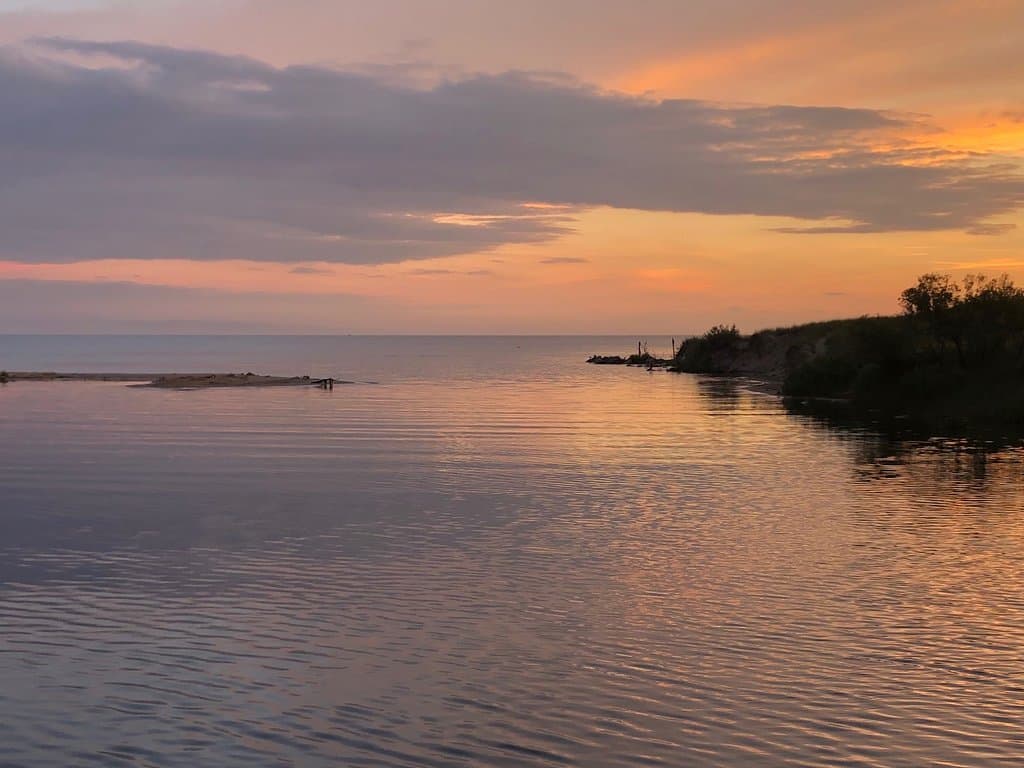 dusk at the mouth of the river