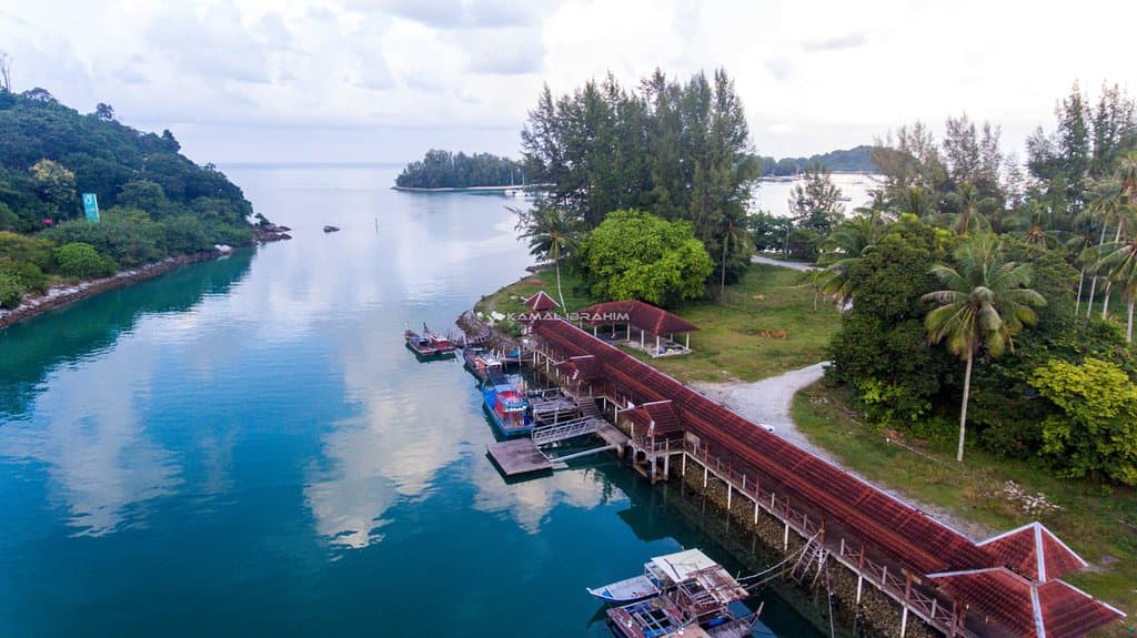 Telaga Harbour - a small fishermen's jetty located just a short distance away from the place where rich men anchor their luxury yachts and boats.