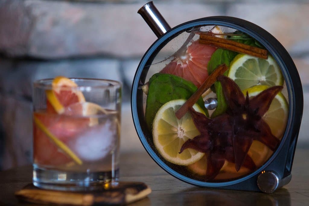 The Porthole. Fresh made daily with local fruits, herbs & spices. Served over a large handout Ice cube, garnished with fresh fruits. A great date night drink...Enough for two to share. 
