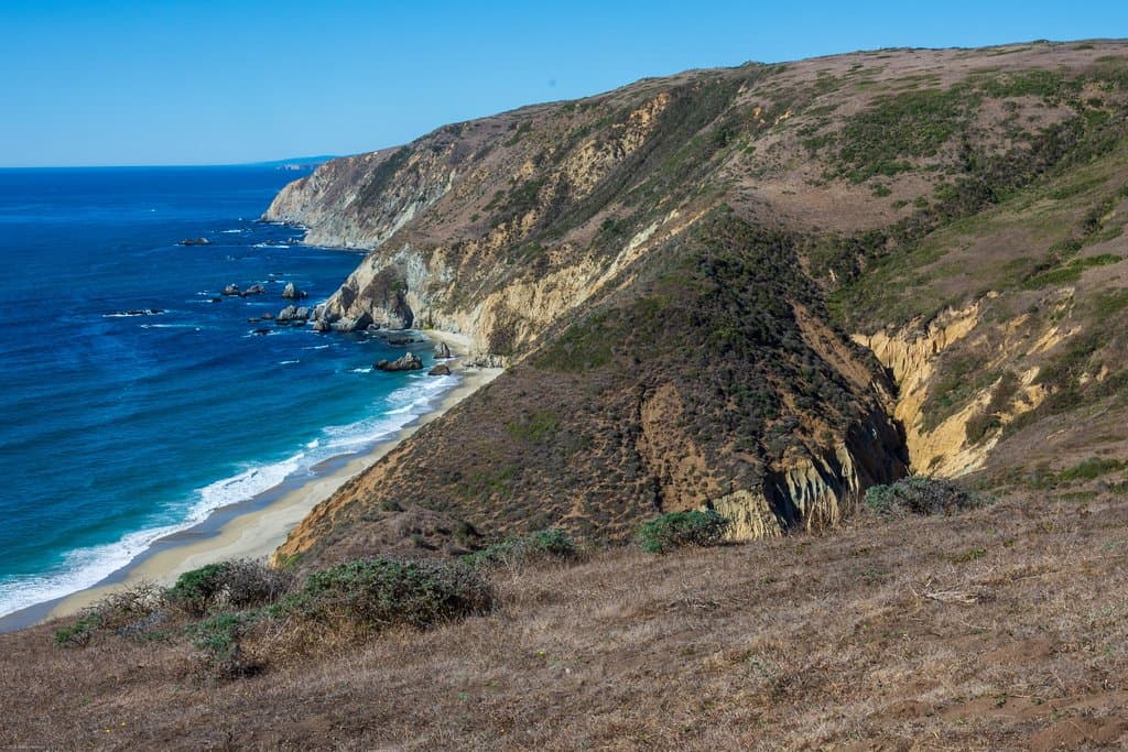 Isolated sandy beach below ridge