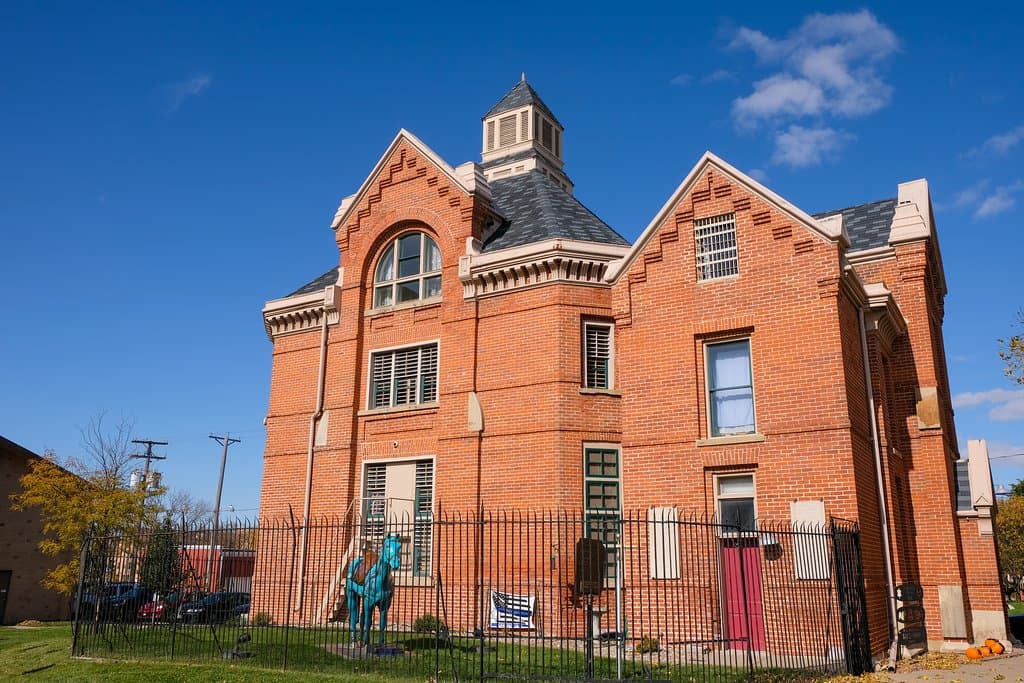 This 1885 three-story Victorian-Gothic style, brick structure is extremely unique as it is only one of three left in existence. It served as the jail between 1865 and 1969. Town legend has it that the jail is haunted. During Halloween season — and sometimes throughout the year, —  the jail hosts popular flashlight tours and paranormal investigations.