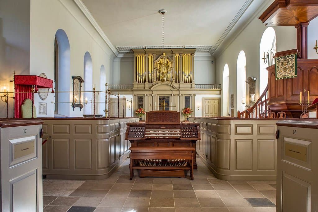 Console of new organ is moveable from its box out to the center aisle, as shown here.