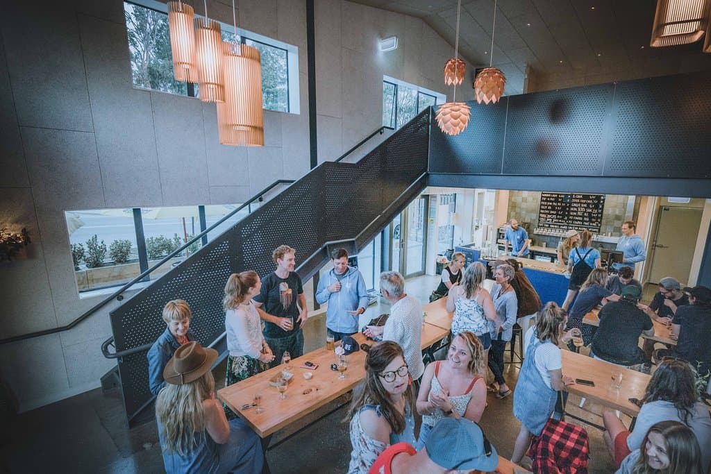 Modern industrial interior with large tables for sharing. 