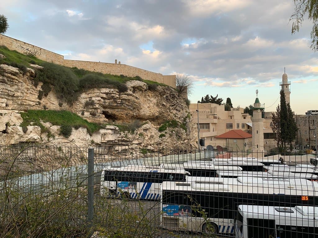 Place of the Skull.  You can still see the eyes, and yes, it is looking over a bus station