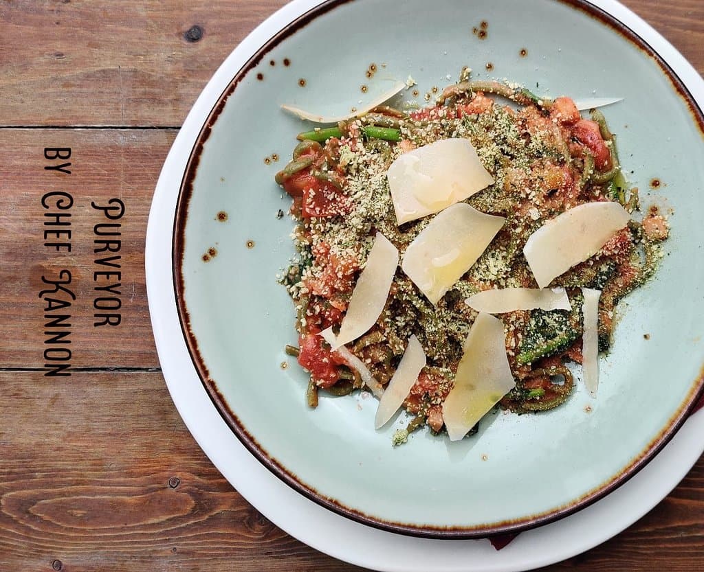 Root Vegetable Bolognese - basil infused spaghetti wiht San Marzano tomato, grana padana, and herb crust - Vegetarian dish 