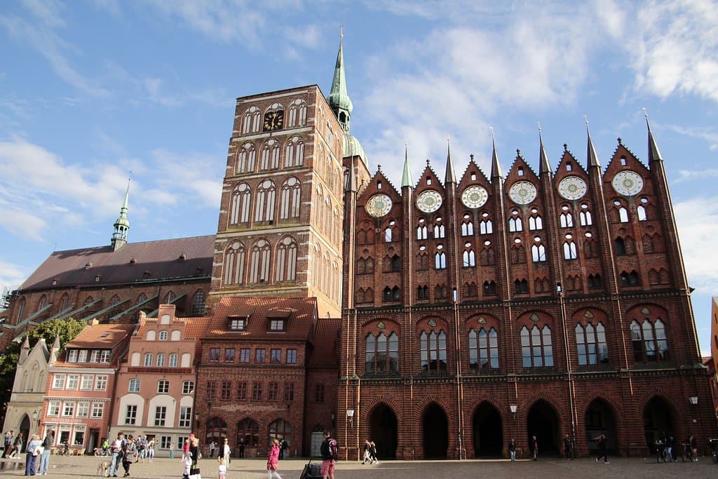 Stralsund, Mecklenburg-Vorpommern, Germany, Alter Markt - southern frontage with Gothic Town Hall and St. Nicholas Church. 