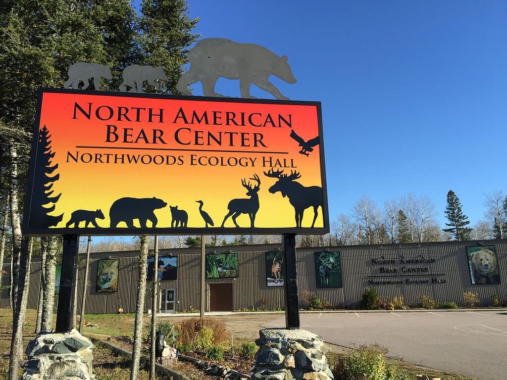 You can't miss our well-lit sign as you drive down Hwy 169. 

Stop in for a visit, great things await you inside! We offer a variety of programs daily. You won’t want to miss our Free Behind the Scene tours which are available with your paid admission, good for the entire day.

Learn about trees, plants, wild bear foods, bear and animal sign while taking a casual walk on our 1/4-mile interpretive nature trails. No admission required to enjoy the trails or rest/eat under our covered pavilion.
