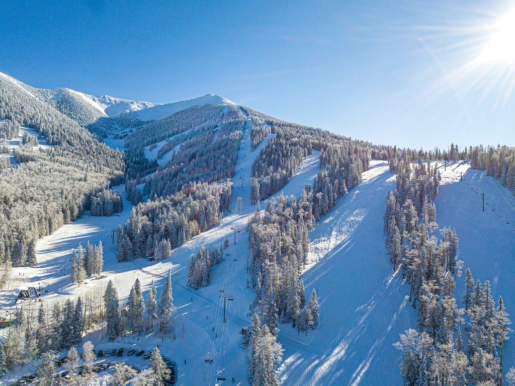 55 trails, 2,300' of vertical drop, and 260 average inches of snowfall. This is winter at Snowbowl.
