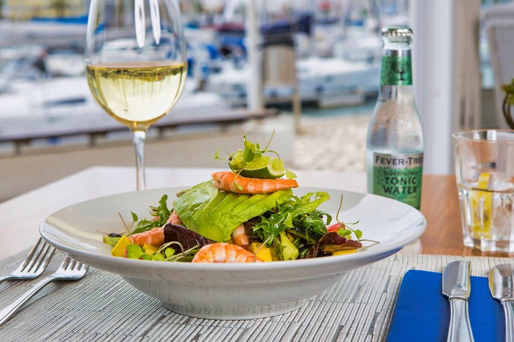 Prawn avocado and mango salad with coriander and chilli dressing.