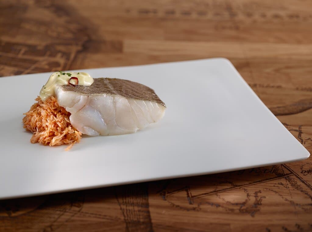 Bodegón Alejandro - Bacalao con txangurro a la donostiarra y pil pil