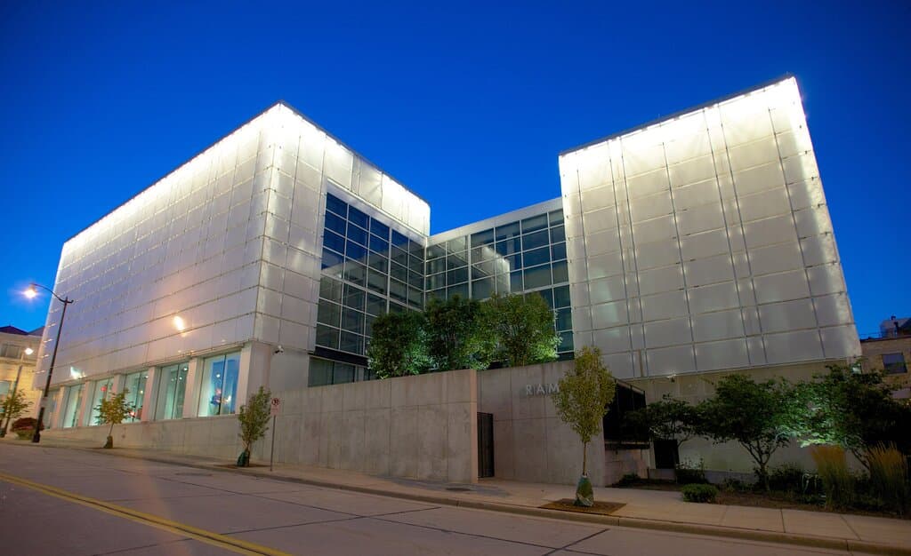 Night view of Racine Art Museum from Fifth Street. The unique street-facing Windows on Fifth Gallery offers long-term contemporary craft exhibitions to all who pass by.