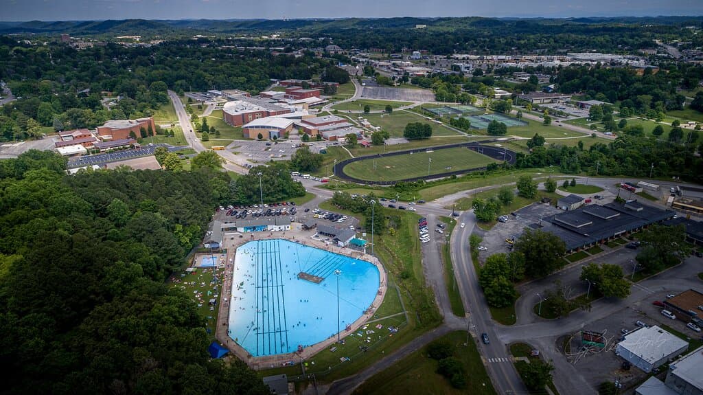 Another aerial view of the Oak Ridge outdoor pool showing its proximity to the Grove Center Shopping Center and the Oak Ridge High School complex.
