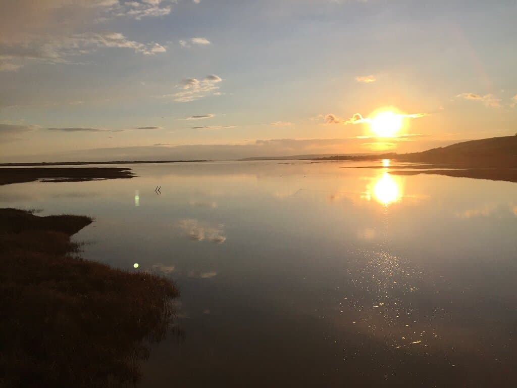 Kidwelly Quay was restored in the 1980s to provide a delightful walk, views and areas to sit, picnic and enjoy the view.    Walk from the town square (station Road) and across the level crossing and a few hundred yards further.  Good free parking across two separate areas.  The Quay itself is a winner with fishermen and bird watchers.  Behind the Quay is the Kymer Canal, with information boards showing the fascinating history.  Then go for a walk along the shoreline and onto the tow path.