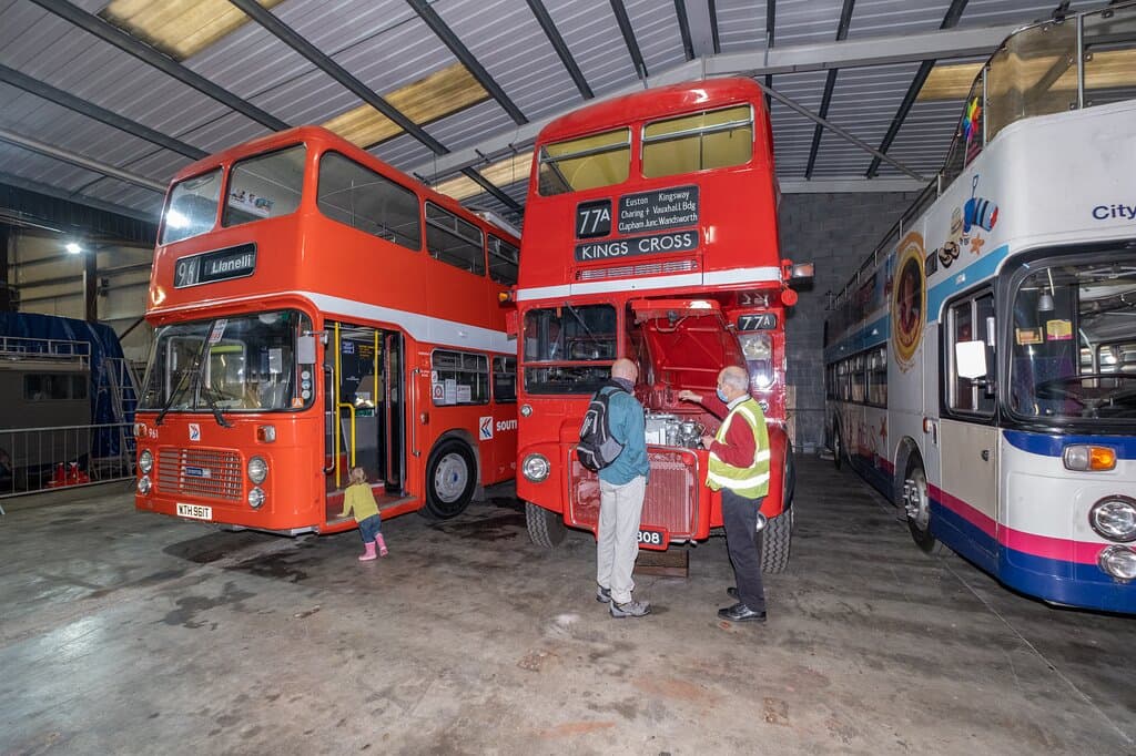 A volunteer showing my husband the engine