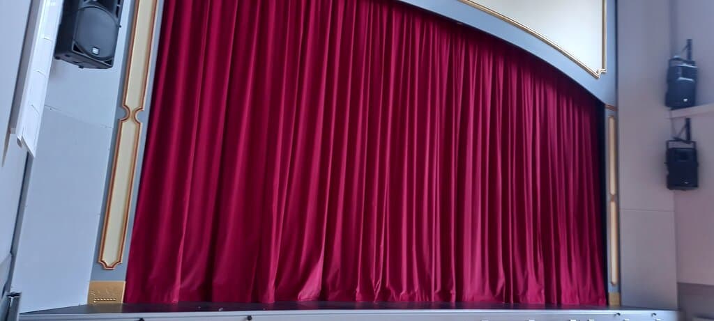 Red velvet curtains all ready to swish