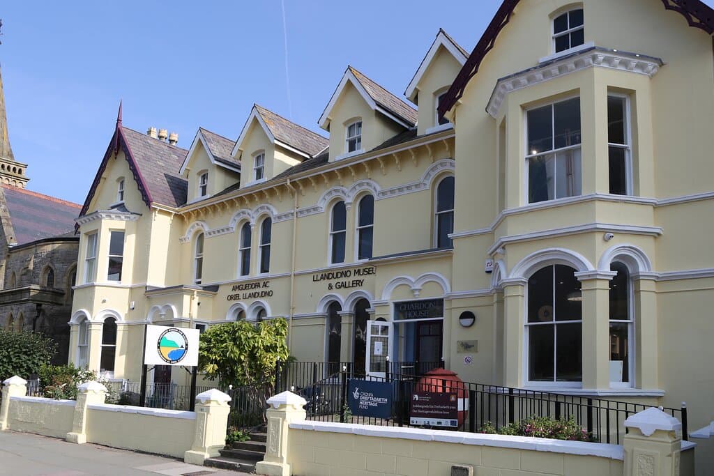 Up Mostyn Street, left at Carlton roundabout, past Wetherspoons. Yellow house just after the church