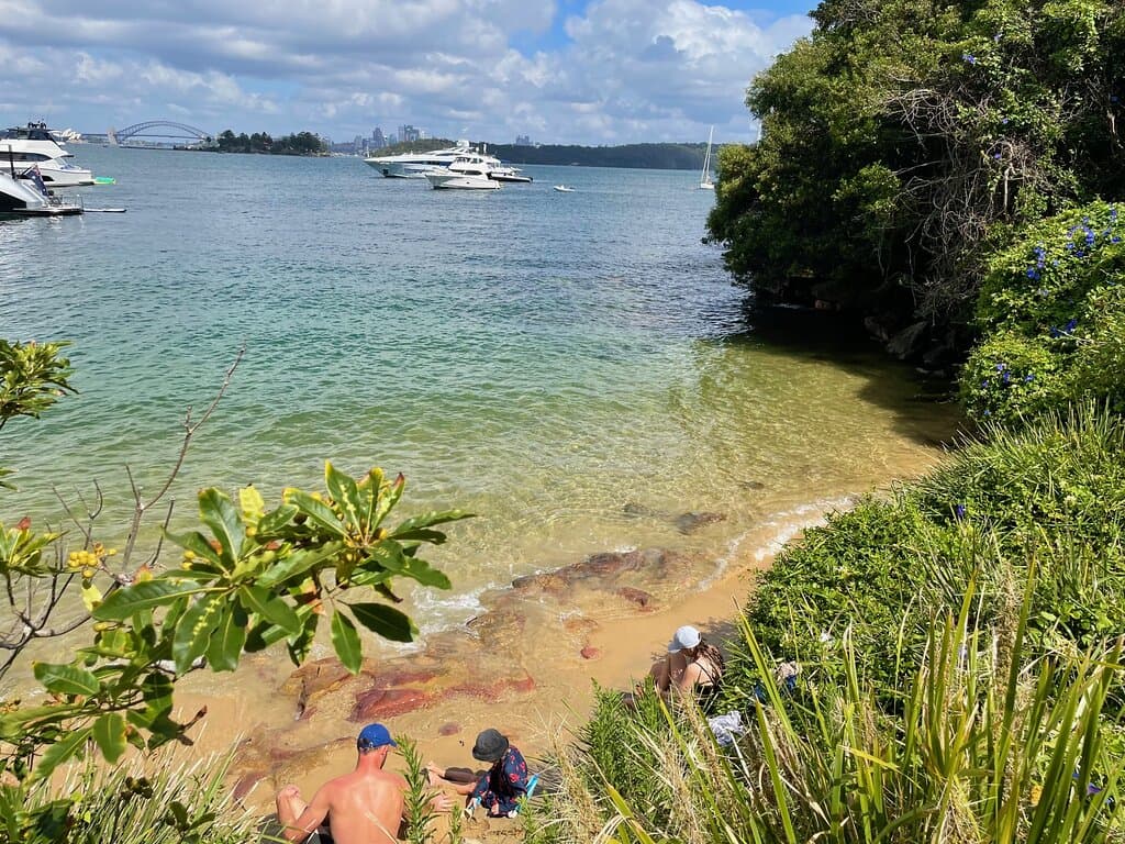 Queens Beach is a tiny secluded Sydney harbour beach, which is hidden along the harbour foreshore and is accessed via the Hermitage Foreshore Walking Trail.  From here, you look directly across the harbour towards the city skyline, the Opera House and Harbour Bridge.   