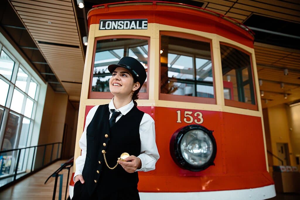 Actor-Interpreter Chantal Gallant next to Streetcar 153 in the Museum of North Vancouver, 115 West Esplanade in North Vancouver, BC. 
