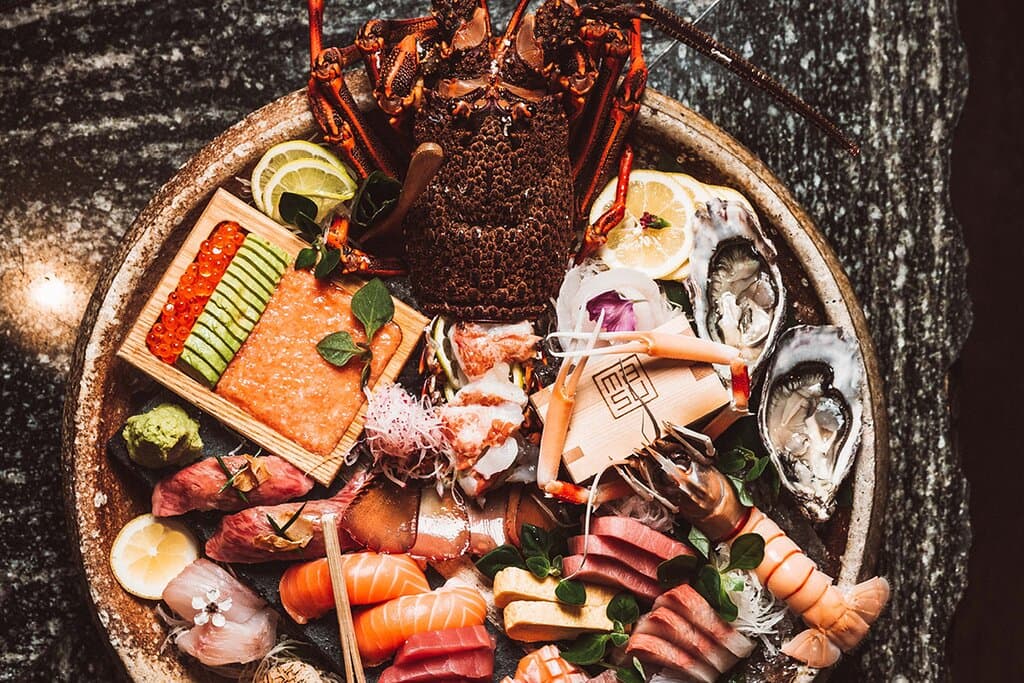 Tokyo Platter, premium 8 sashimi selection, 1/2 nz crayfish sashimi, chirashi tartare, sushi rice crackers, 4 deluxe nigiri, 4 pacific oyster