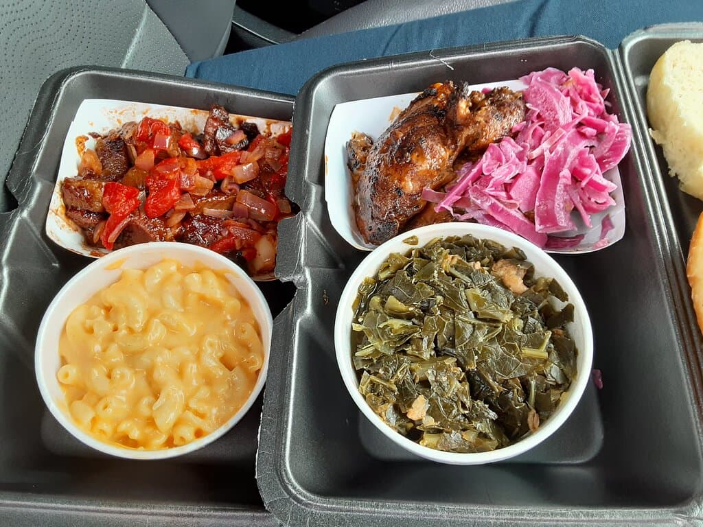 Burnt ends and mac 'n cheese (left); jerk chicken and collard greens (right).