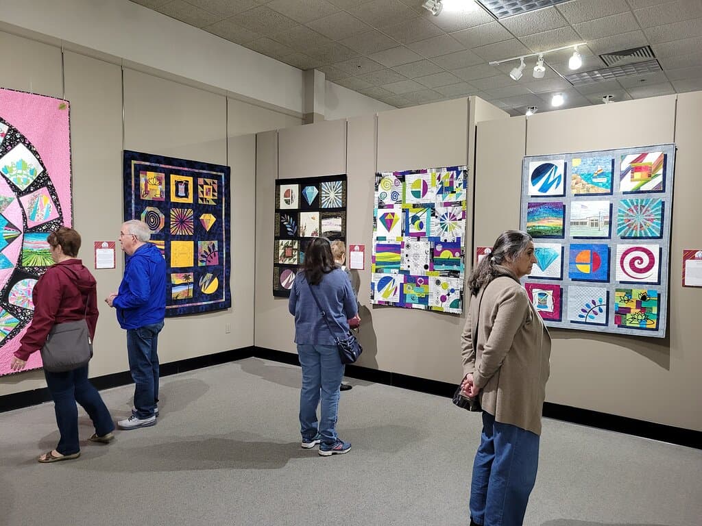 Visitors enjoy the exhibitions during Paducah's annual AQS QuiltWeek event