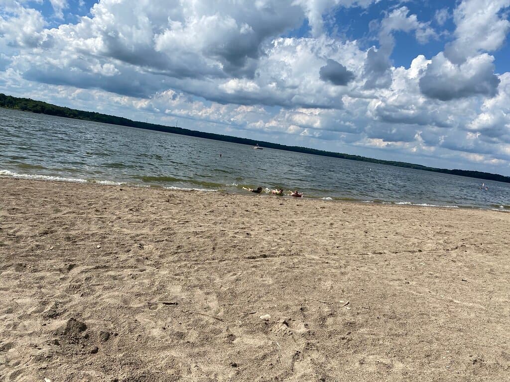 Public beach. Handicapped accessible. Restrooms nearby. Parking nearby. Bring your own floaties, chairs, & coolers. My nephew says it has “off brand sand” but otherwise, the kids love it!