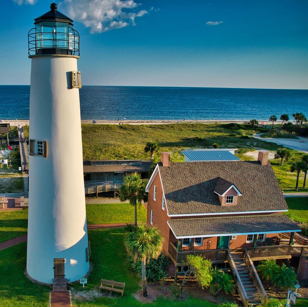 Cape St. George Lighthouse along side of the Keeper's House Museum & Gift Shop