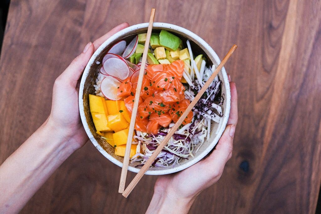 Salmon Ponzu Chirashi - Rice Bowl. Fresh salmon, in zesty shoyu sauce, avocado, raddish, daikon & cabbage. 