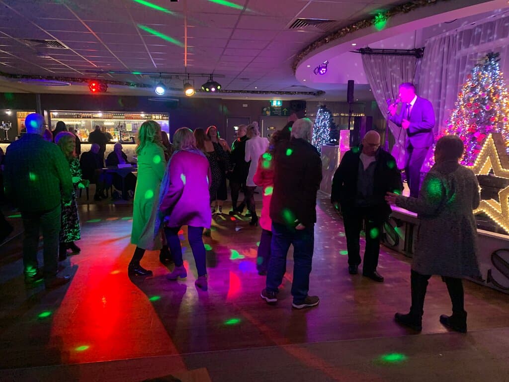 Actual picture of people dancing in coats and hats