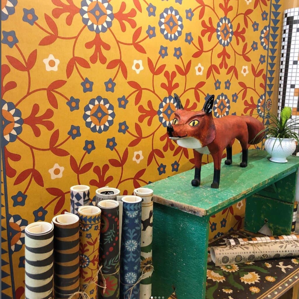 Roy Minshew's handsome fox posing in front of our vintage vinyl floor cloths.